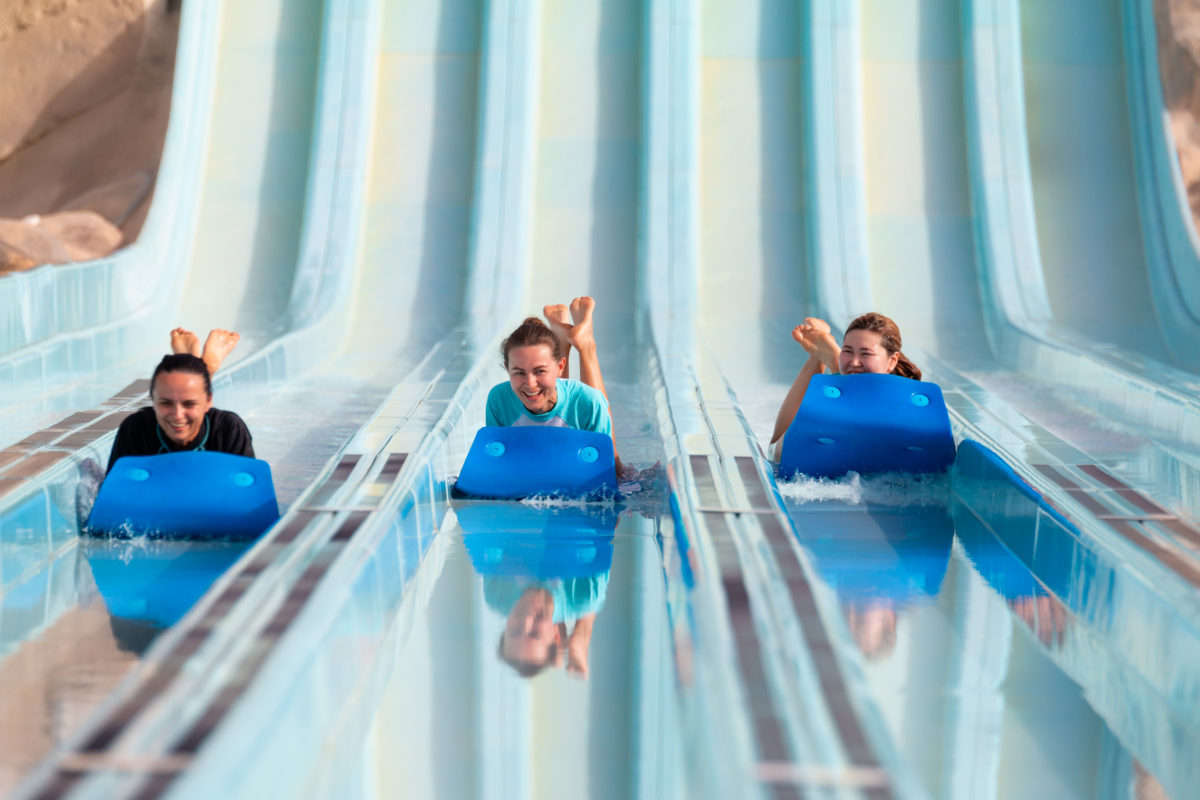 Lifestyle Photography - Models on waterslide at waterpark