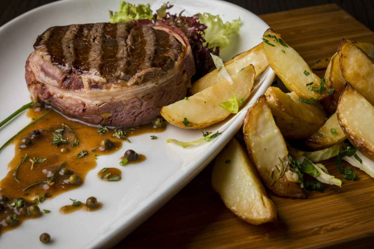 Food Photography - Italian Cuisine - Beef Steak with Black Pepper Sauce and Potato Wedges